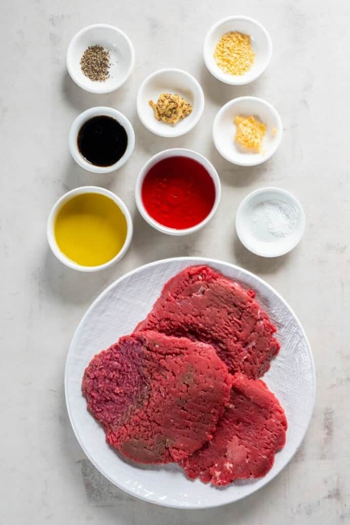 Overhead view of ingredients needed to cook cube steak in the air fryer.