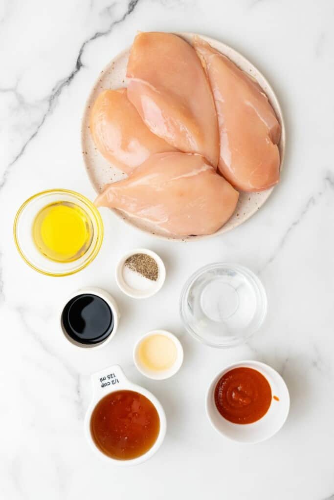 Ingredients to prepare chicken in a cast iron skillet.