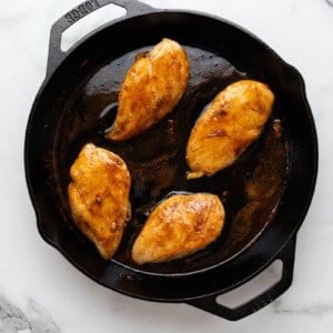 Cooked chicken breast in cast iron skillet