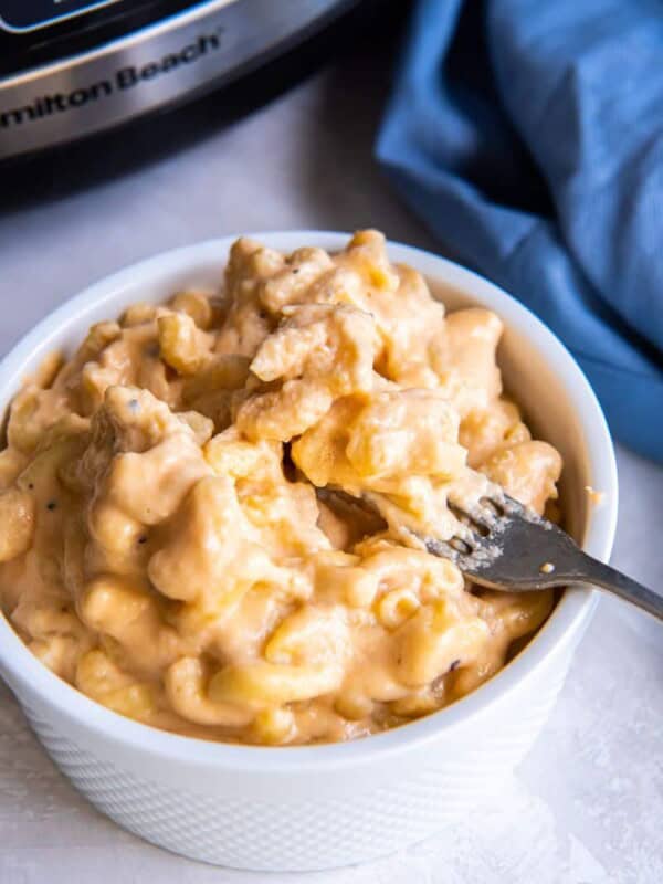 White bowl of 3 ingredient macaroni and cheese prepared in a slow cooker.