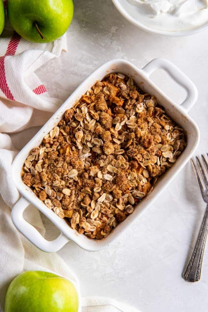 Baked Air Fryer Apple Crisp in a white rectangle pan.