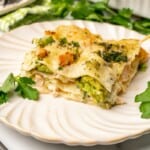 Chicken and Broccoli Lasagna on an off white plate.