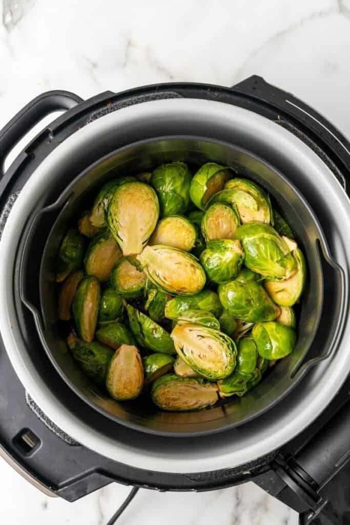 Brussels Sprouts in a Ninja Foodi ready to be cooked.