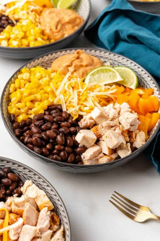 Angled view of ingredients for a southwest bowl resting in a gray bowl ready to be combined.