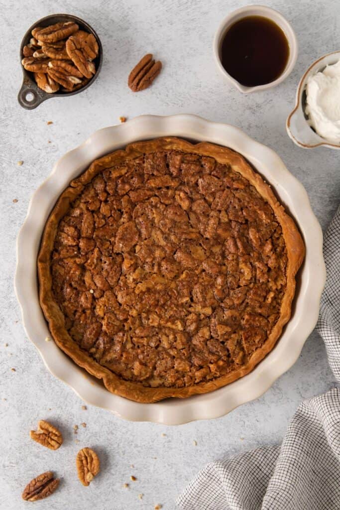 Baked pecan pie with no corn syrup in the pie pan from overhead.
