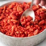 Close up of the strawberry crunch recipe in a bowl with a spoon.