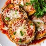 Air fryer eggplant Parmesan on a plate side by side.