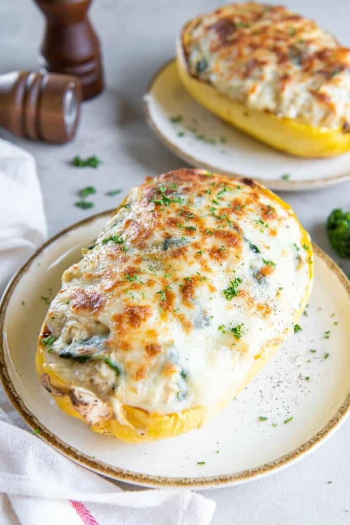 Closeup view of baked spaghetti squash with chicken alfredo.