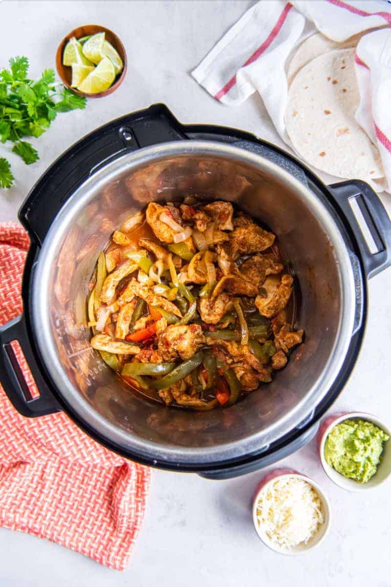 Chicken Fajita ingredients resting inside an Instant Pot.