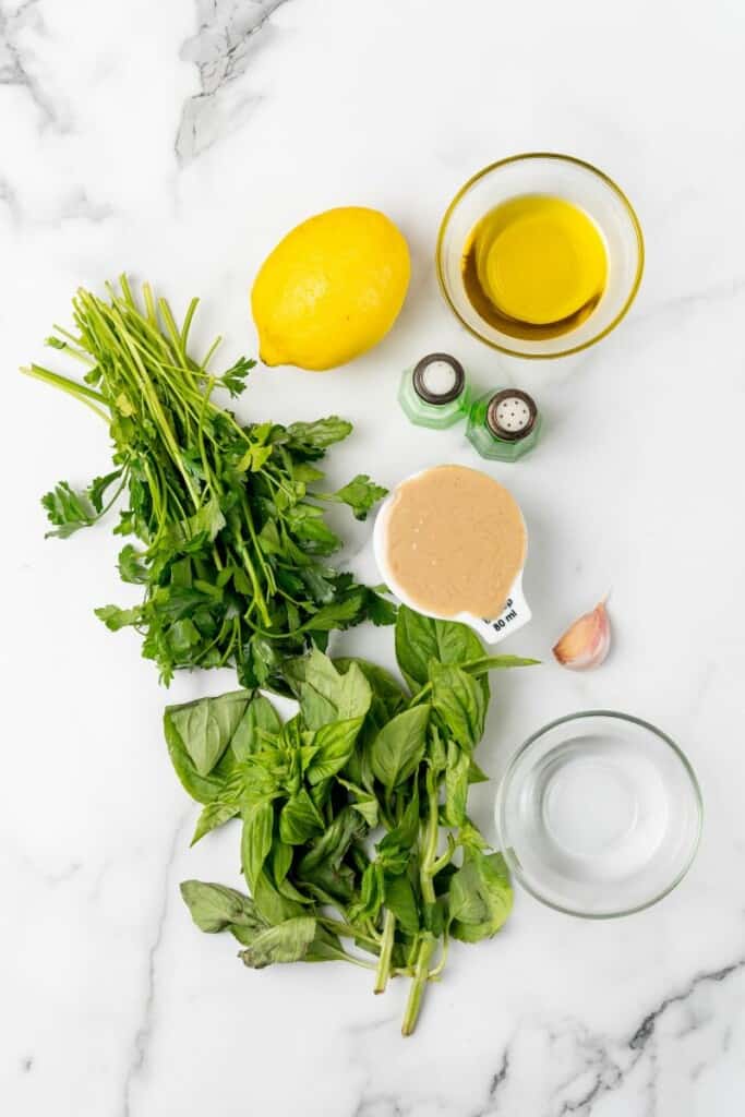 Ingredients needed to prepare lemon herb tahini.