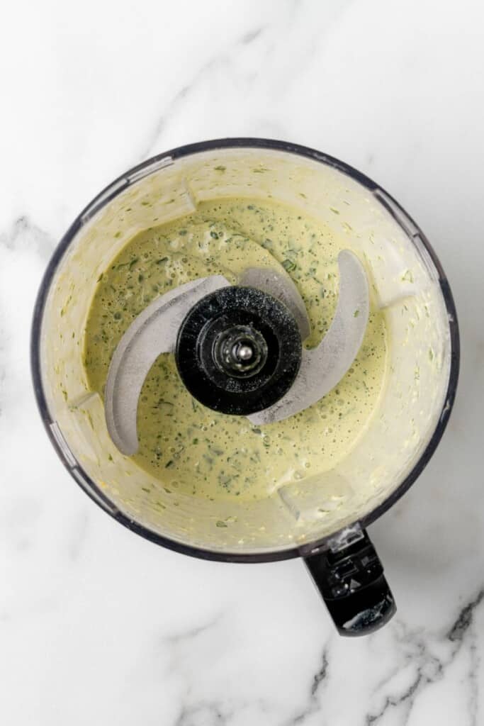Ingredients for Lemon Herb Tahini pulsed until smooth in a food processor.