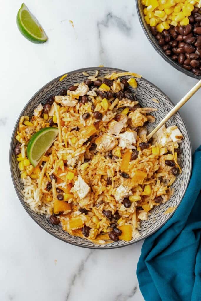 Overhead view of Southwest Bowls in a gray bowl with a spoon.