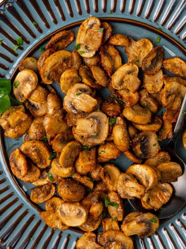 Air fryer mushrooms on a blue serving plate.