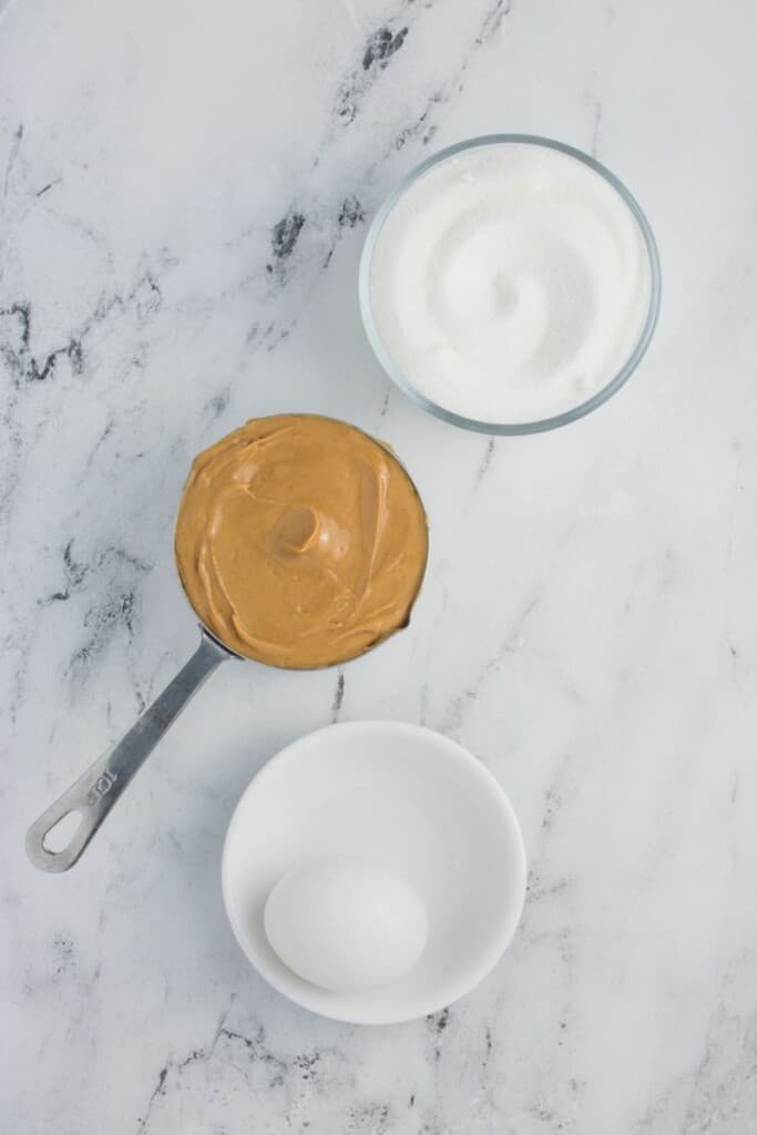 Ingredients needed to prepare peanut butter cookies.