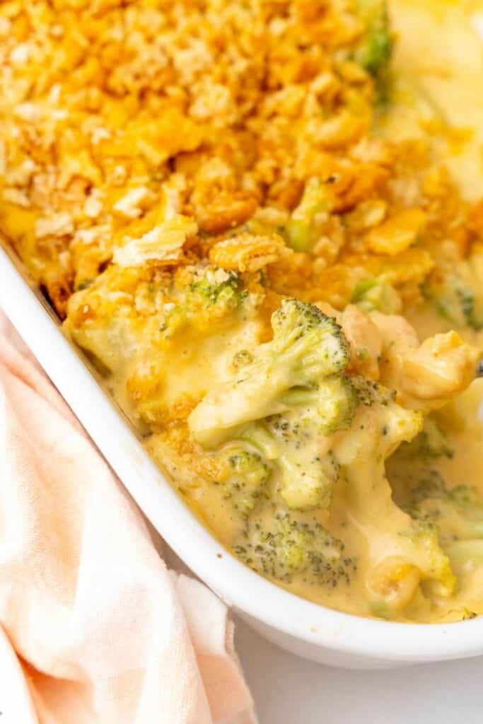 Close up view of prepared ritz broccoli casserole in a casserole dish.