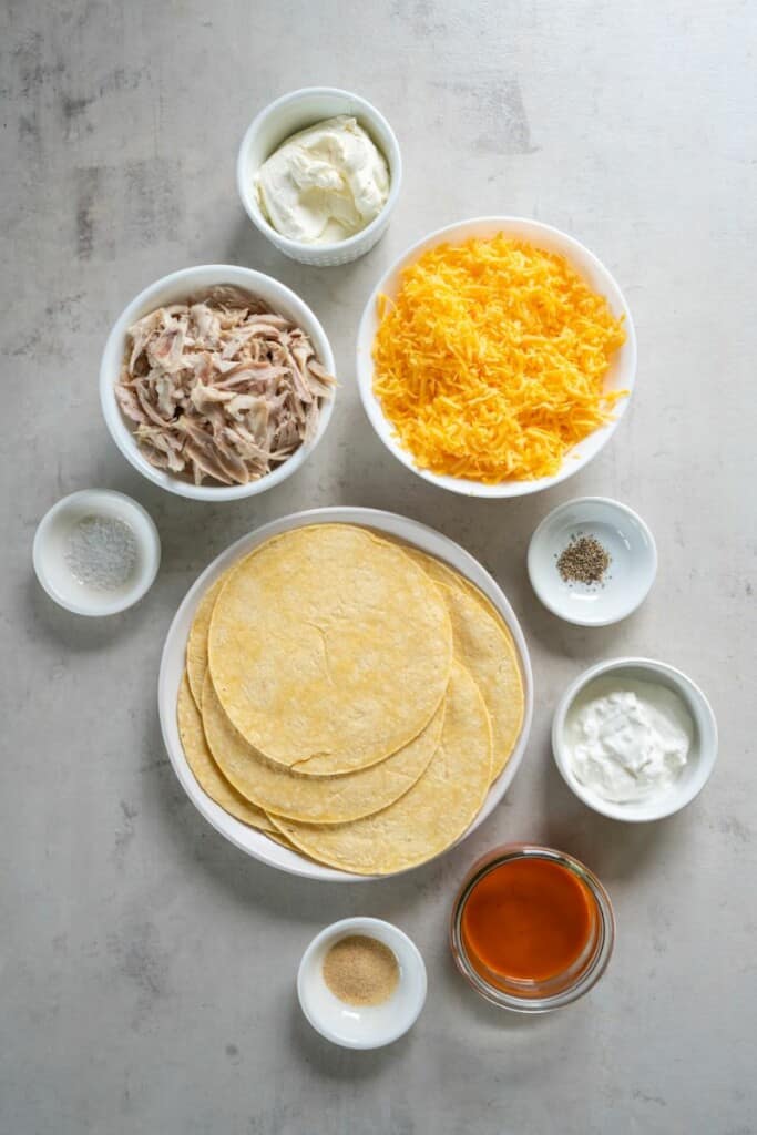 Ingredients needed to prepare buffalo chicken taquitos.