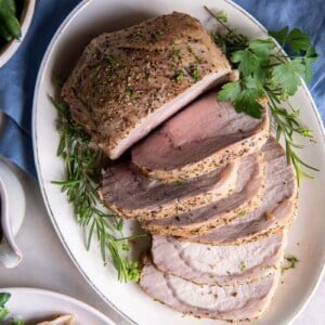 Overhead view of pork loin cut into slices.