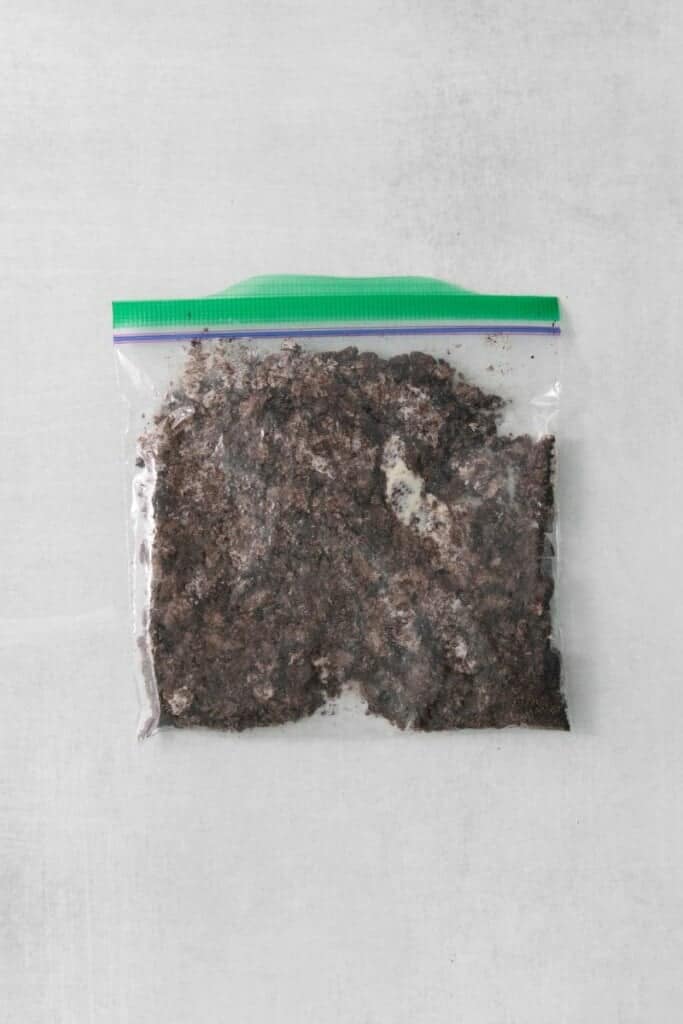 Six oreos crushed in a zip top baggie.