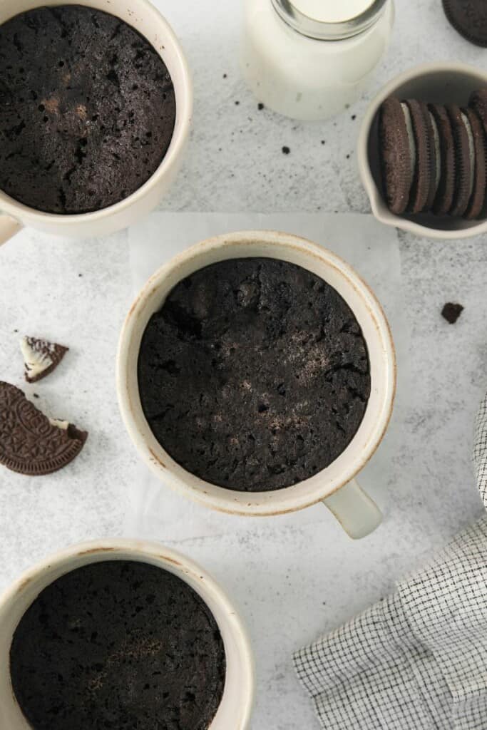 Overhead view of oreo cake in a mug.