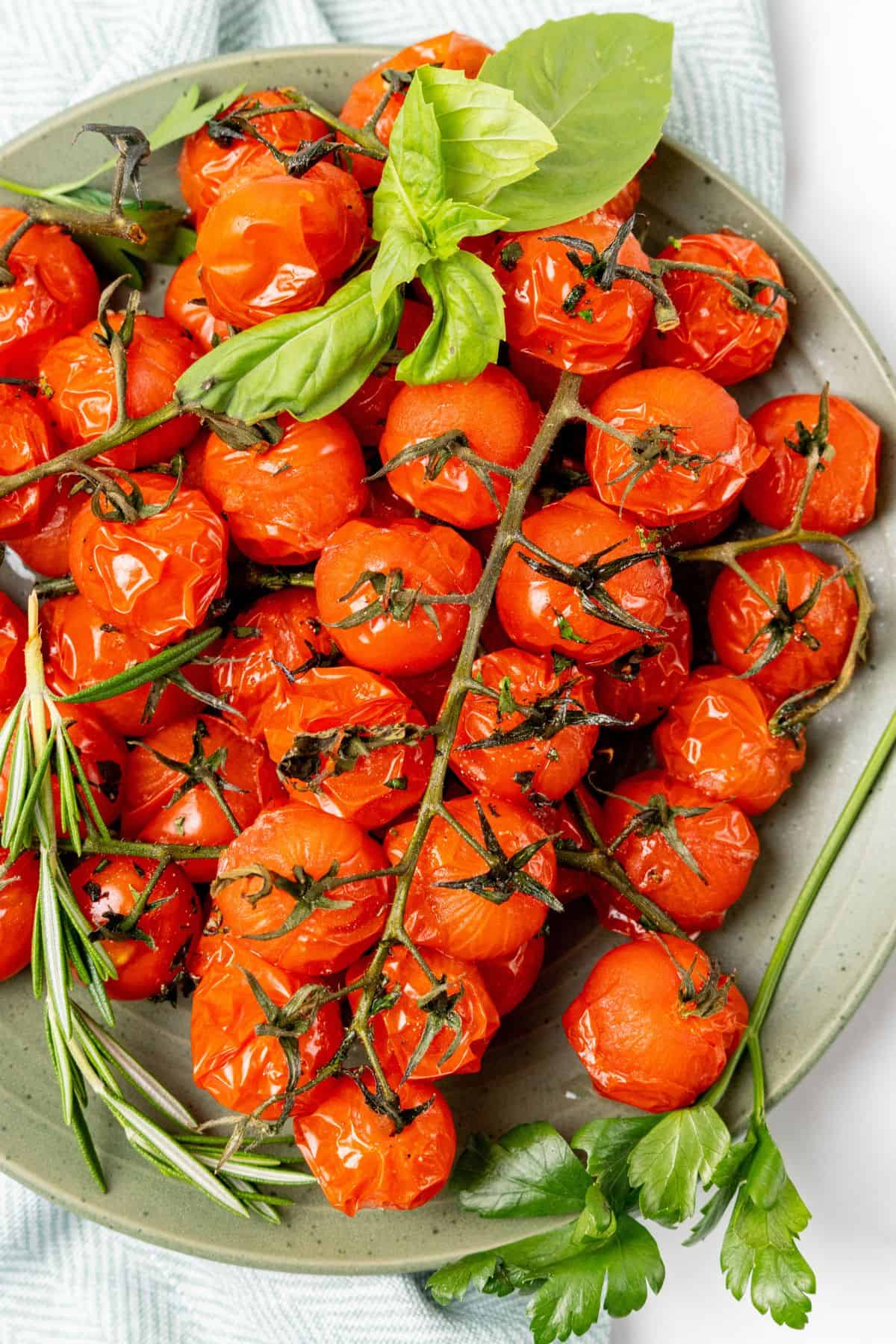 Air fried roasted tomatoes on a plate ready to be eaten.
