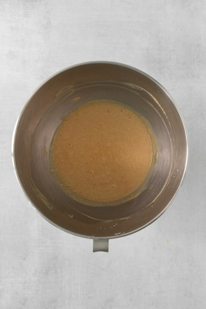 Combining peanut butter, powdered sugar and vanilla extract in a mixing bowl.