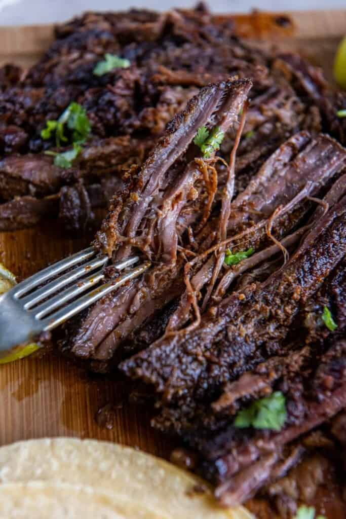 A close up view of a sliced skirt steak.