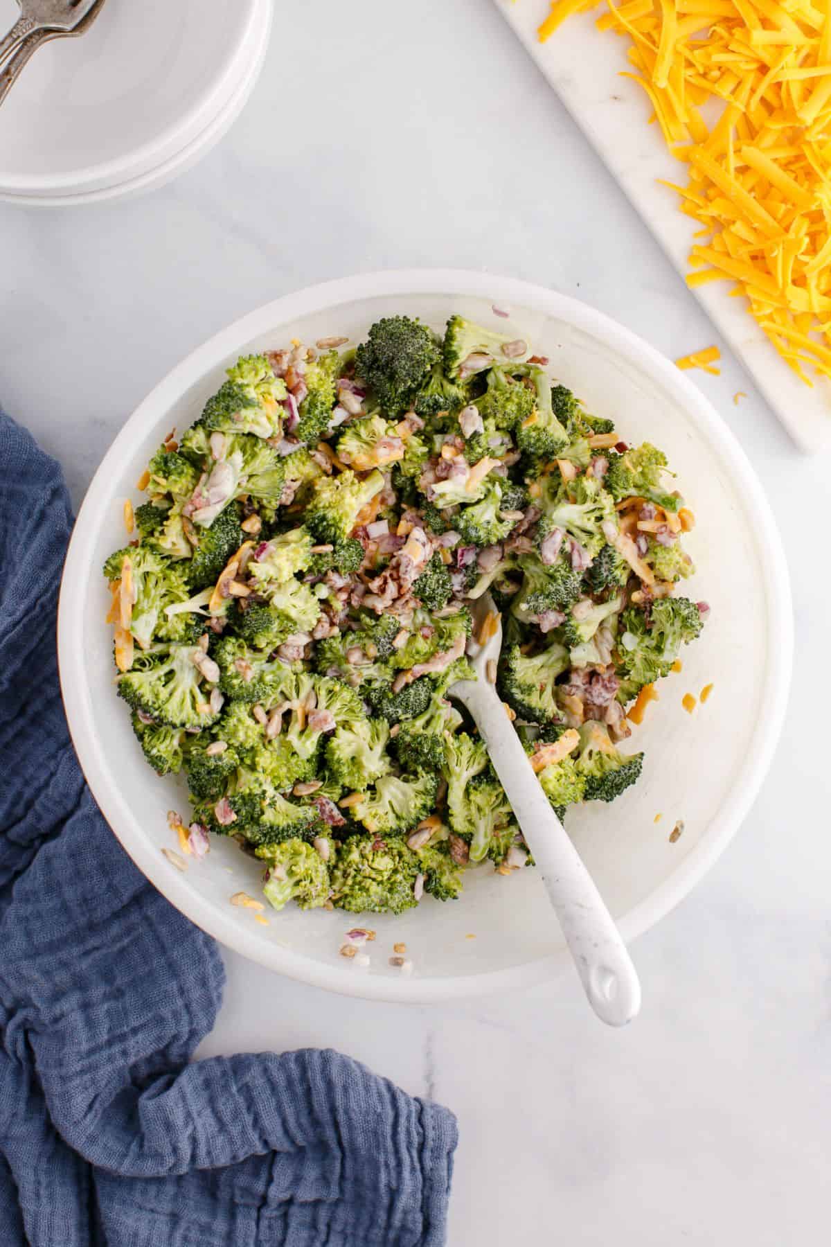 Mixed cold broccoli salad together and ready to be chilled.