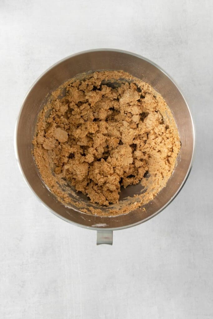 mixing peanut butter with powdered sugar.