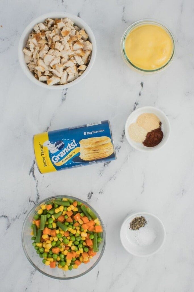 The ingredients needed to prepare a biscuit topped chicken pot pie.