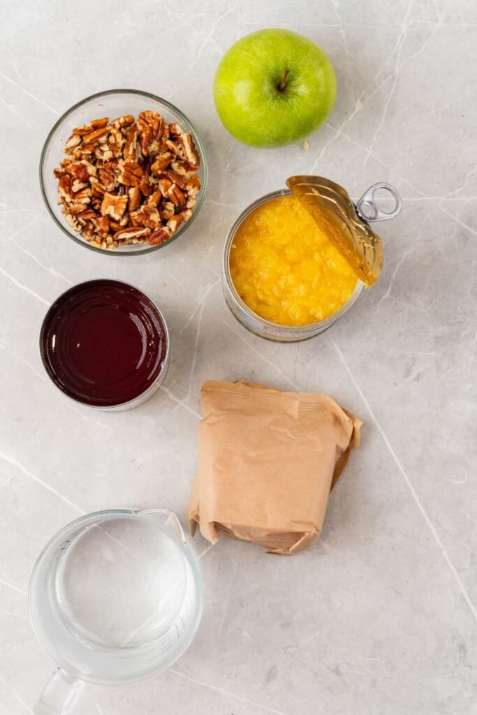 Ingredients needed to prepare cranberry jello salad.