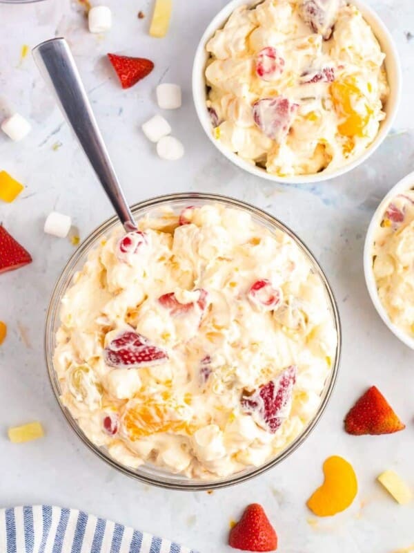 cool whip fruit salad in 3 bowls.