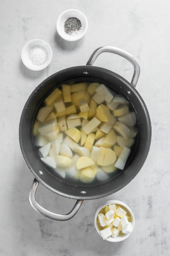 cubed potatoes in a pot with water and salt.