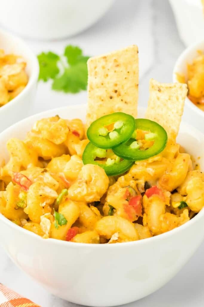 a bowl of mexican macaroni with tortilla chips