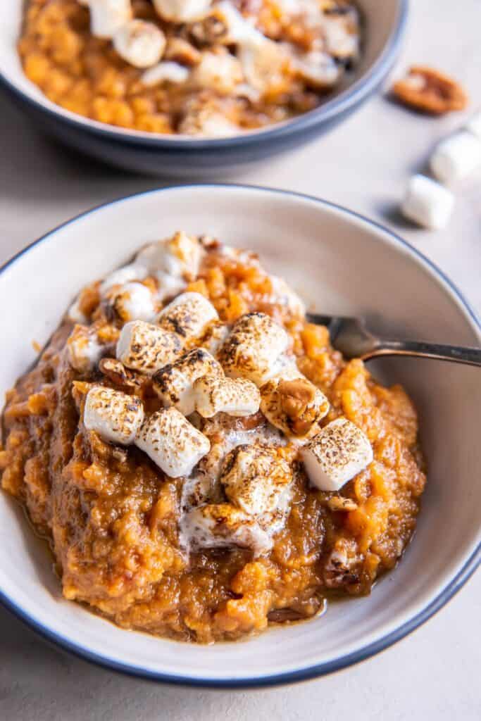 Close up of served crock pot sweet potato casserole in a small bowl.