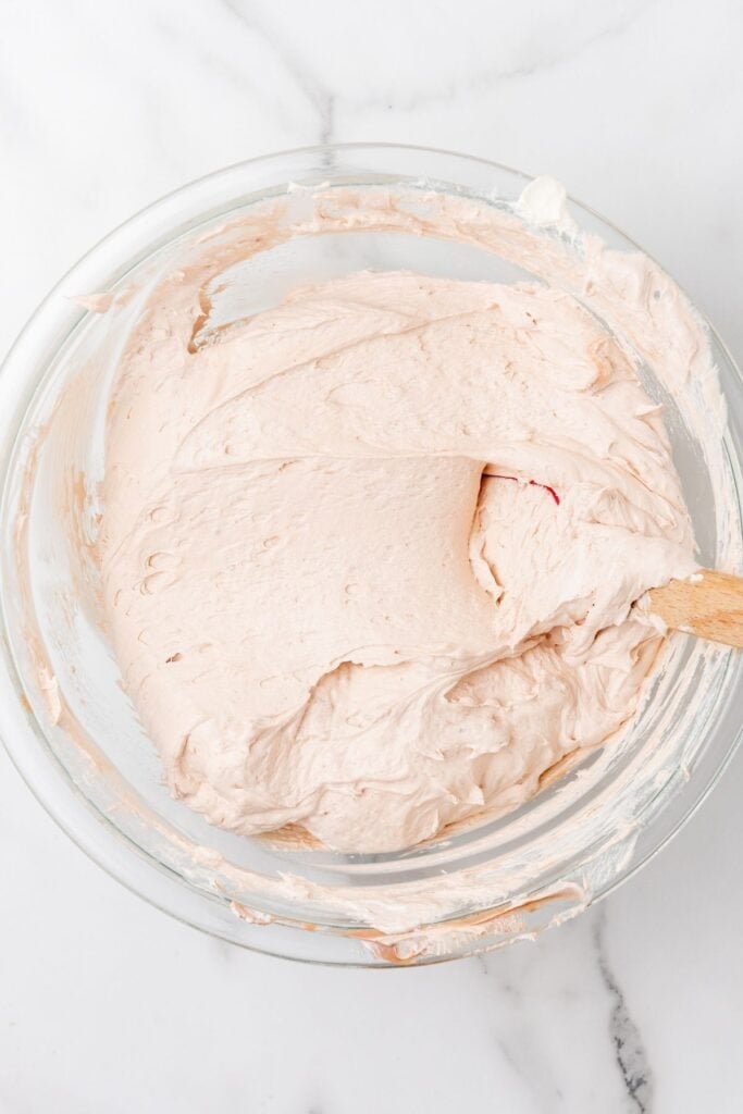 The Cool Whip folded into the hot chocolate dip recipe in a mixing bowl.