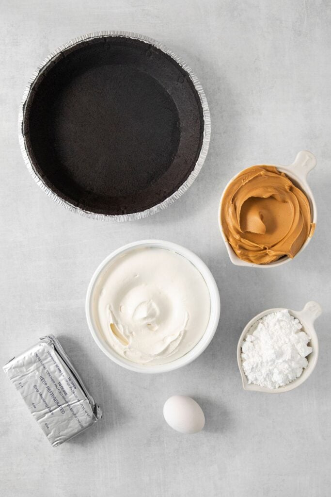 Ingredient needed to make a peanut butter pie with cool whip: oreo pie crust, cream cheese, peanut butter, powdered sugar, and cool whip.