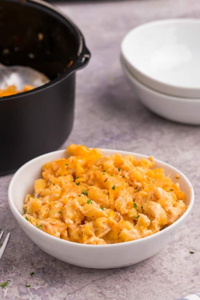 a bowl of cheesy air fryer macaroni and cheese.