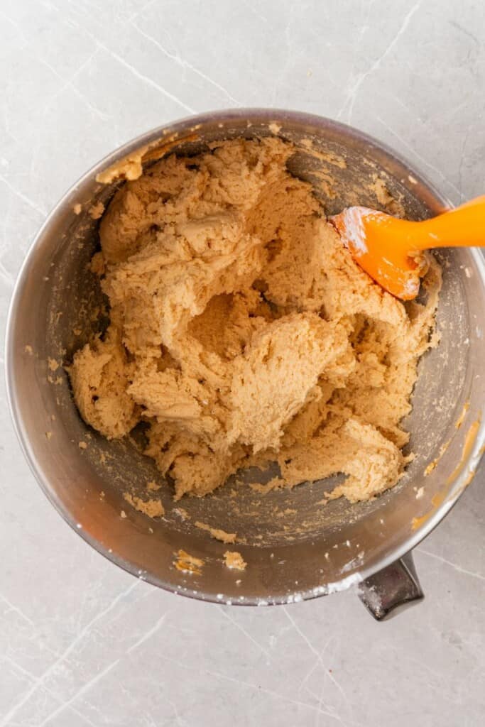 mixing ingredients to make creamy peanut frosting.