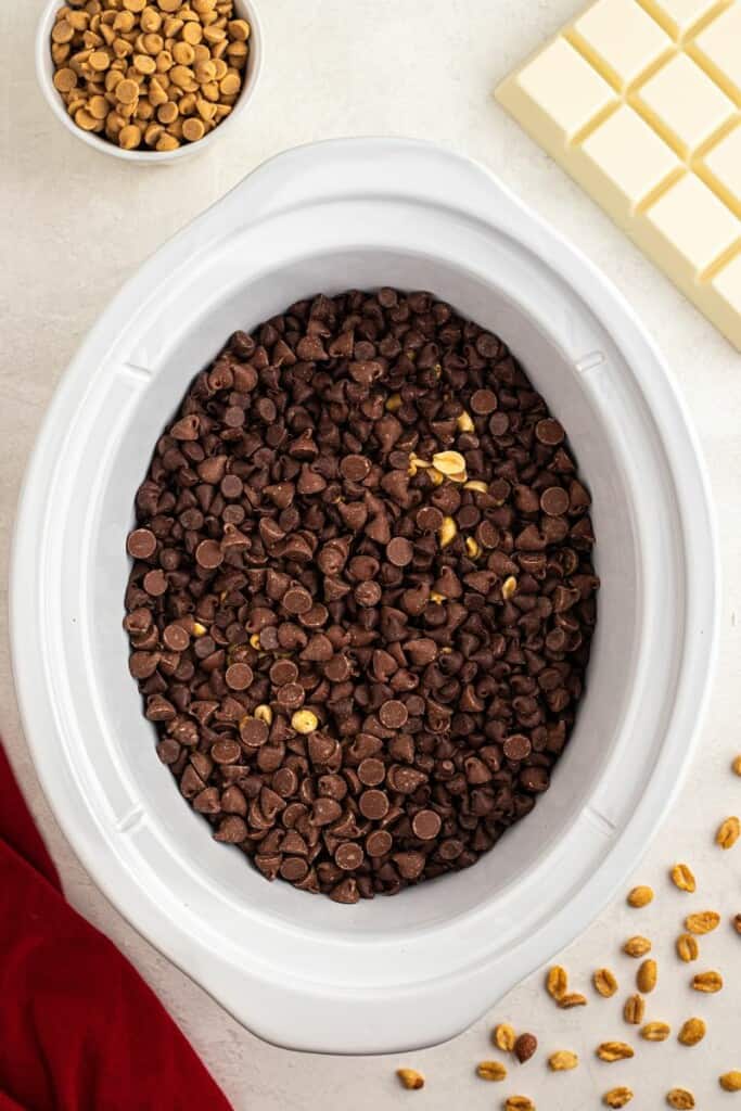 adding chocolate chips over peanuts