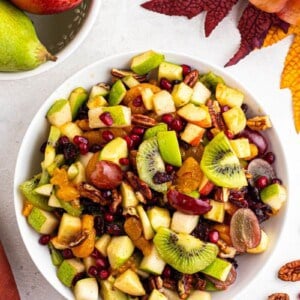 overhead shot of apple pomegranate fruit salad for the holidays.