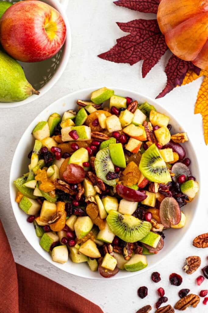 overhead shot of apple pomegranate fruit salad for the holidays.