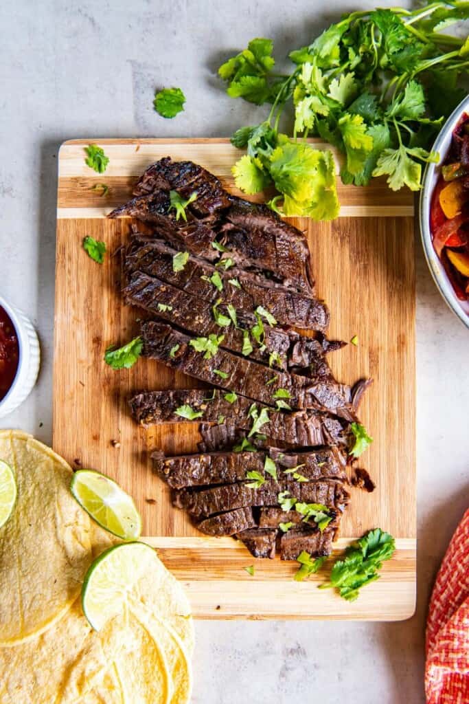 overhead shot of crock pot flank steak topped with cilantro