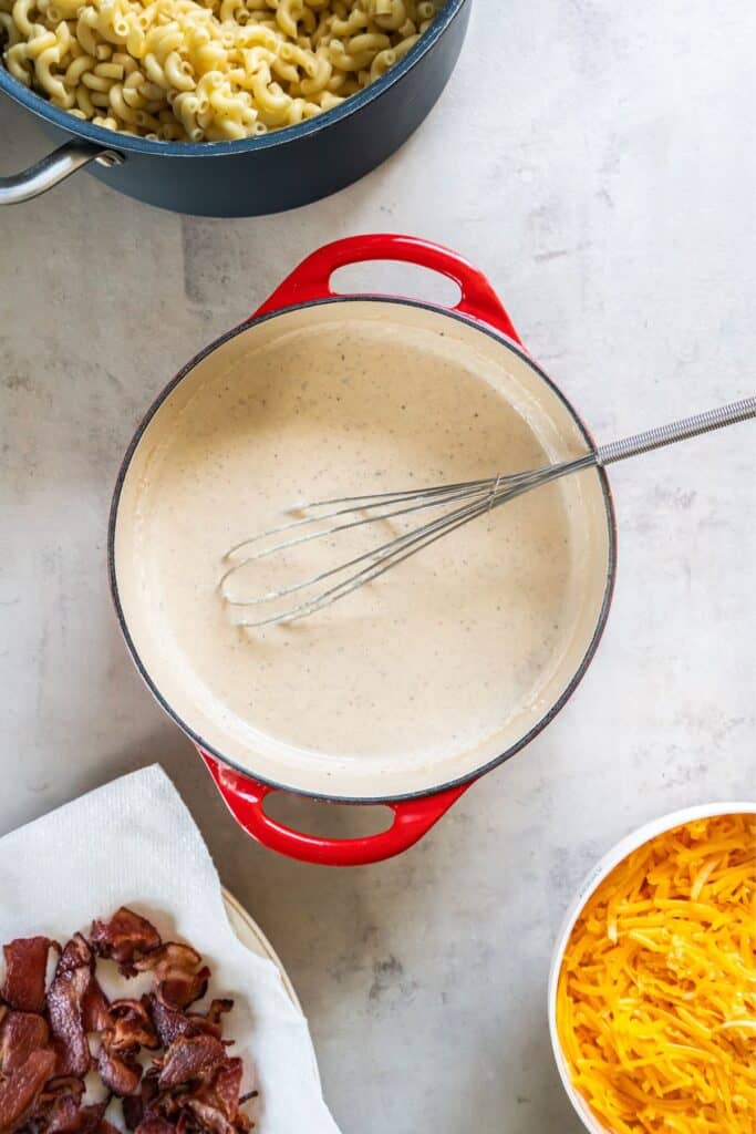 The roux consistency in a pot to make dutch oven mac and cheese.