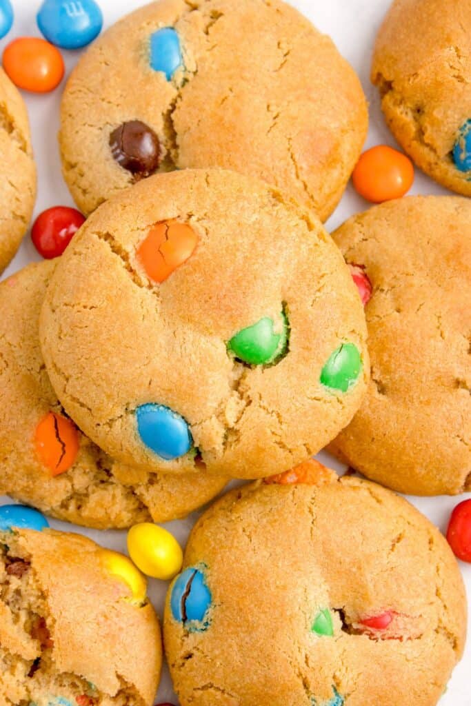 Close up of the peanut butter M and M cookies all stacked on each other.
