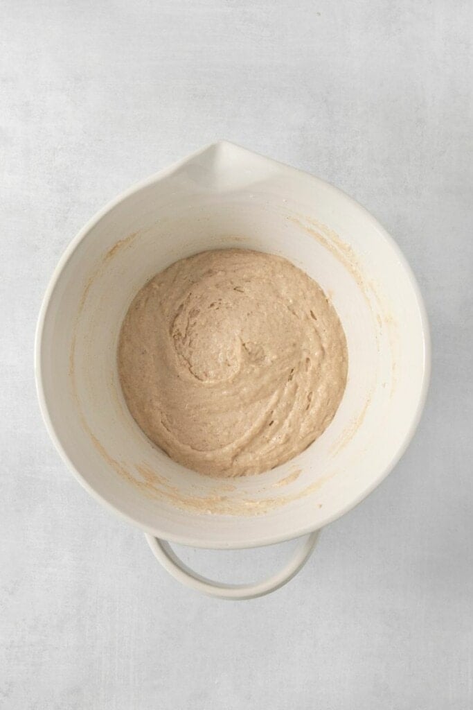 Mixing up pancake batter in a big bowl.