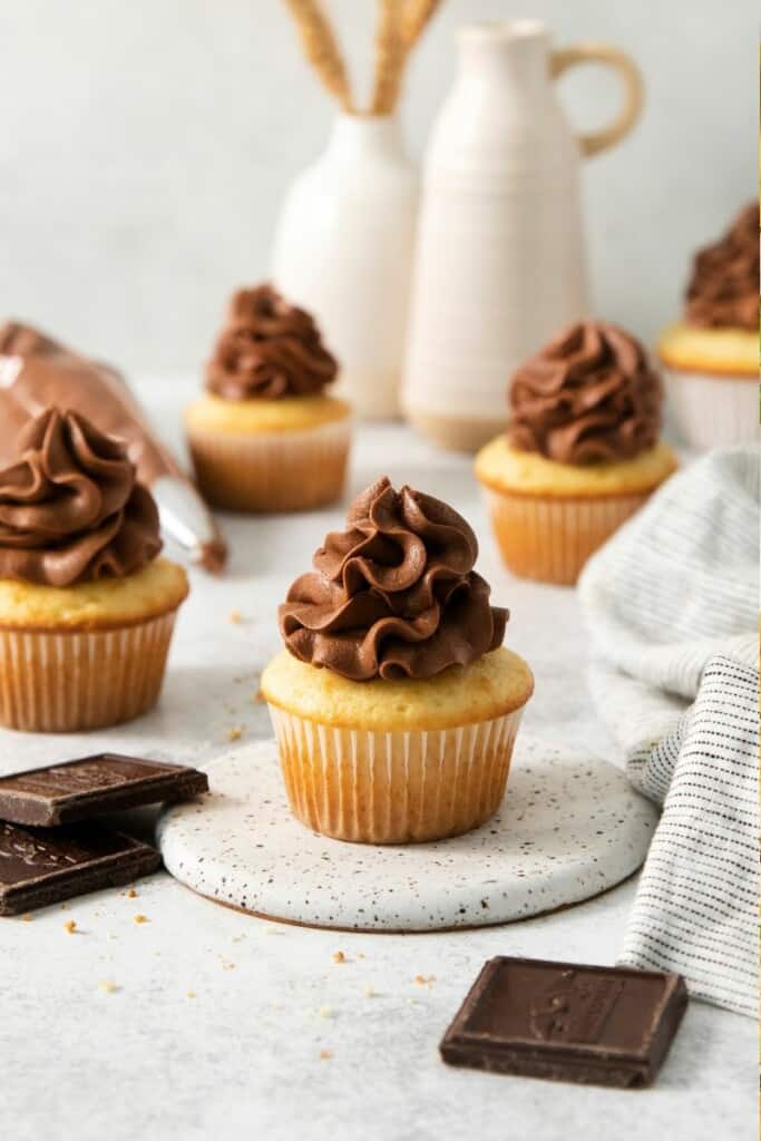 Cupcake with dark chocolate cream cheese topping.