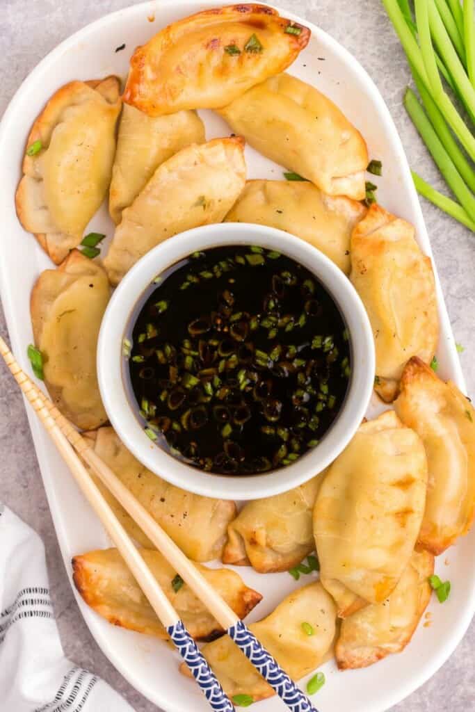 overhead shot of potsticker with soy vinegar sauce