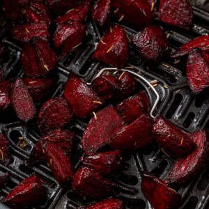Close up of beets in an air fryer basket.