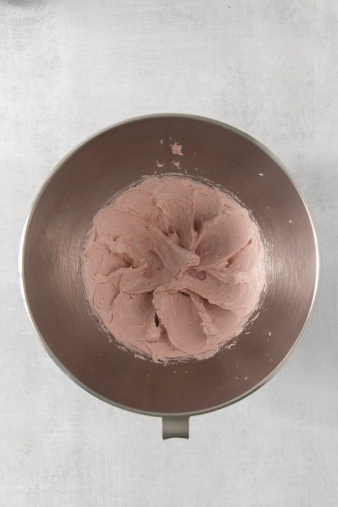whipped strawberry cream cheese dip in a mixer bowl