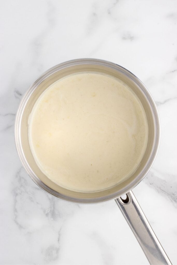 creamy dijon sauce in a sauce pan